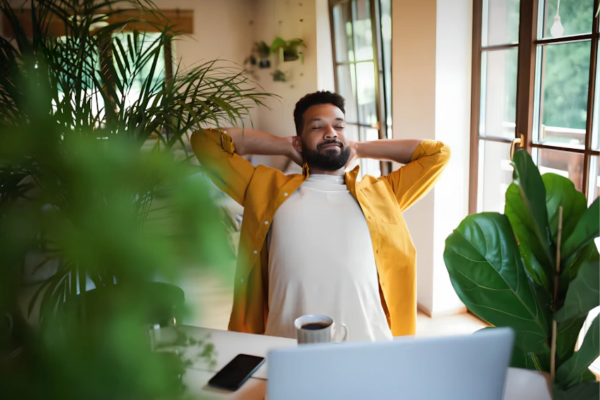 Relaxed employee taking a break at their desk