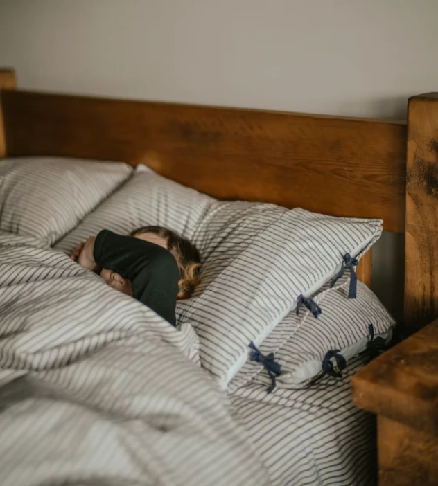 Person sleeping peacefully in bed