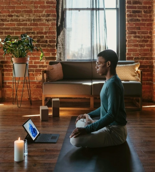 Person practicing mindfulness meditation at home