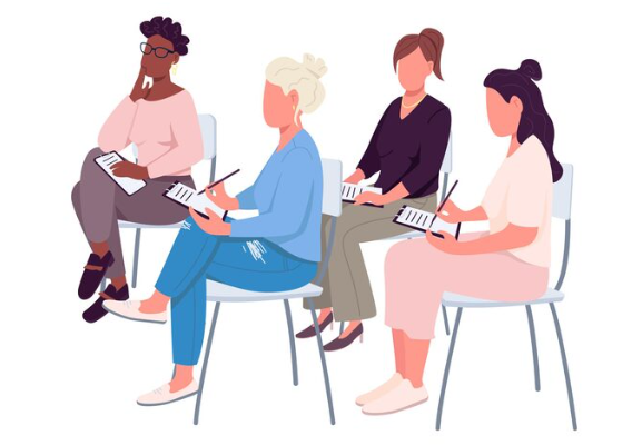 A cartoon illustration of four diverse women sitting in a circle on chairs, each holding clipboards or documents, representing a workplace menopause education or support group session where women can share experiences and learn together.